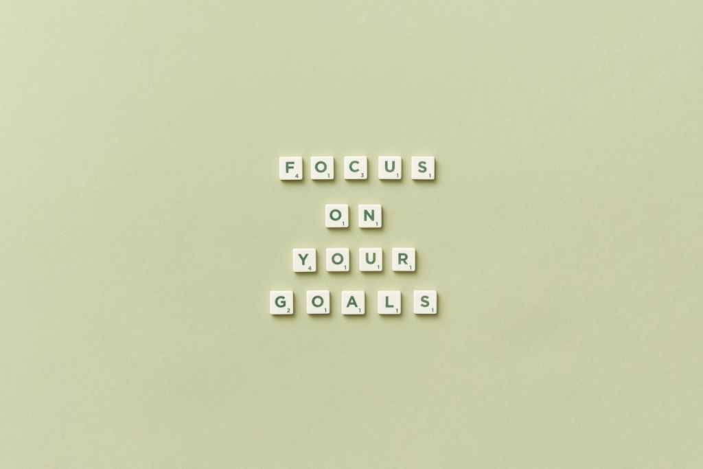 Image of scrabble squares spelling out focus on your goals.